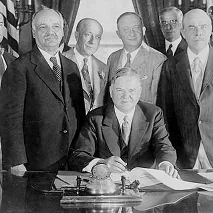 President Hoover sitting in the White House Oval Office