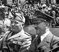 Adolf Hitler riding in an automobile.