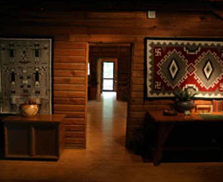 Interior room with door open, showing further rooms.