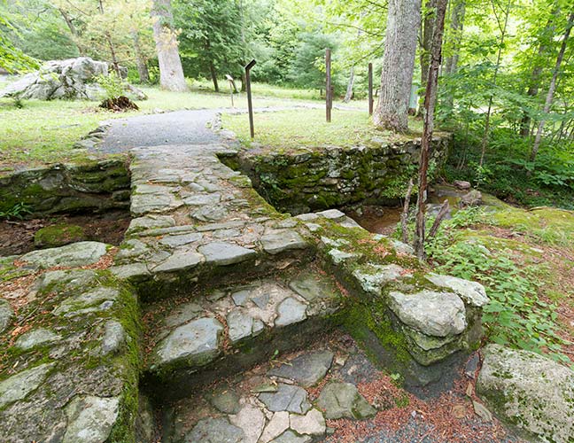The modern day view of a footbridge across Hemlock Run.