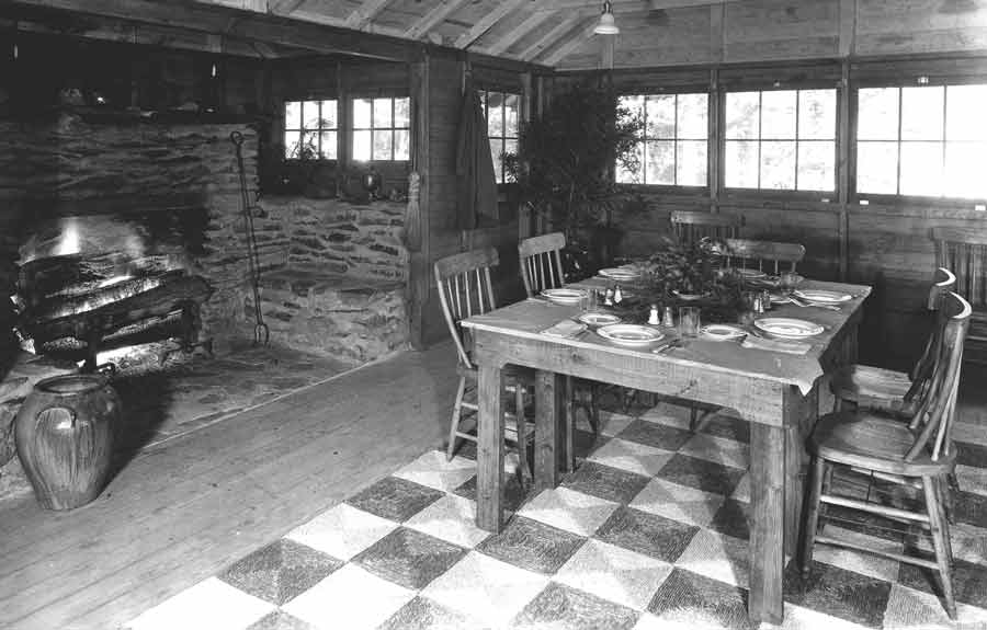 A dining table setup inside the Rapidan Mess Hall.