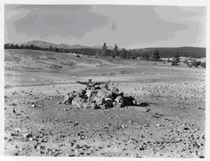 black and white photo of the rocks surrounding the drill cap