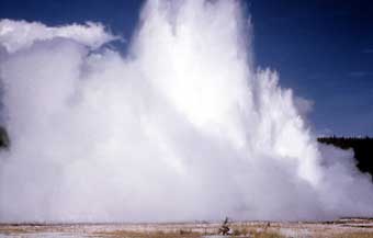 Sapphire Pool erupts in a cloud of steam and water