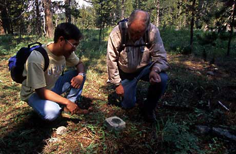 Dr. Smith, right, and a student examine a benchmark.