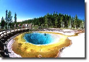 Visitors take in the view of Morning Glory Pool.