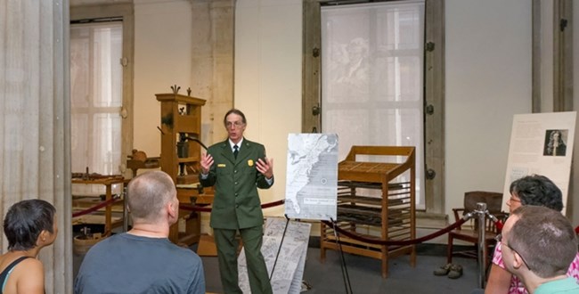 A park ranger conducts a historical program.