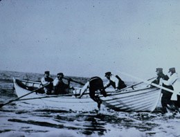U.S. Life Saving Service crewmen launch a surfboat