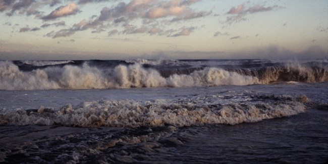 Storm waves crash onshore.