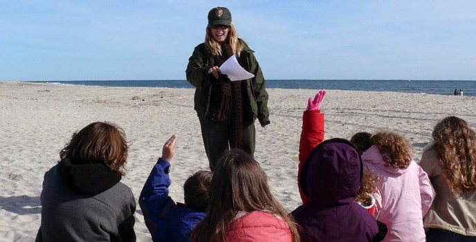 Ranger leading a program with kids on the beach