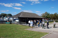 Group gathers around old ferry terminal building and podium. Group gathers around old ferry terminal building and podium.