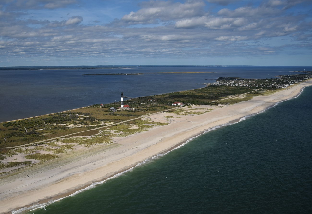 Aerial image of barrier island surrounded by water.