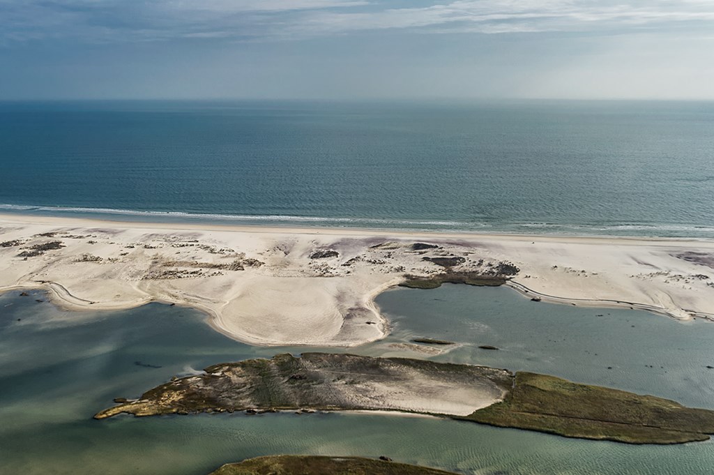 Aerial image of overwash fans pushed across the island by waves.