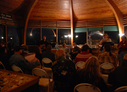 Musicians perform inside Wilderness Visitor Center during evening program.