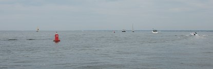 Ferry and other vessels by red buoy in Watch Hill channel.