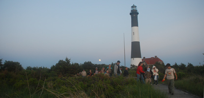 Walk from lighthouse as moon rises.