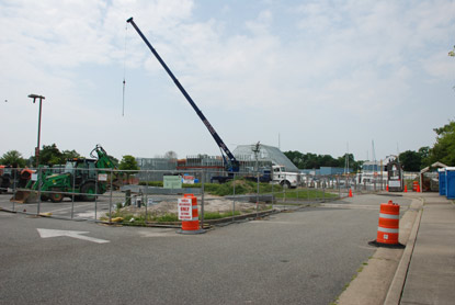 Active construction work with steel framework taking shape.