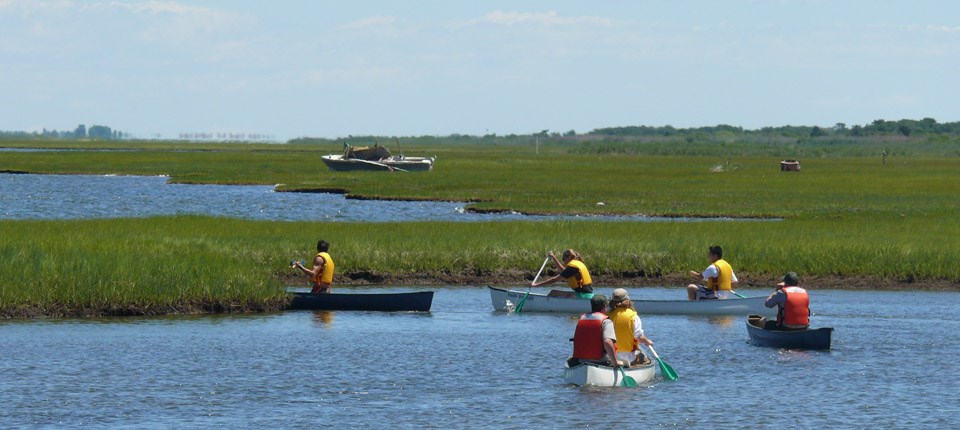 Visitors paddle in the Great South Bay along Fire Island's most extensive salt marsh