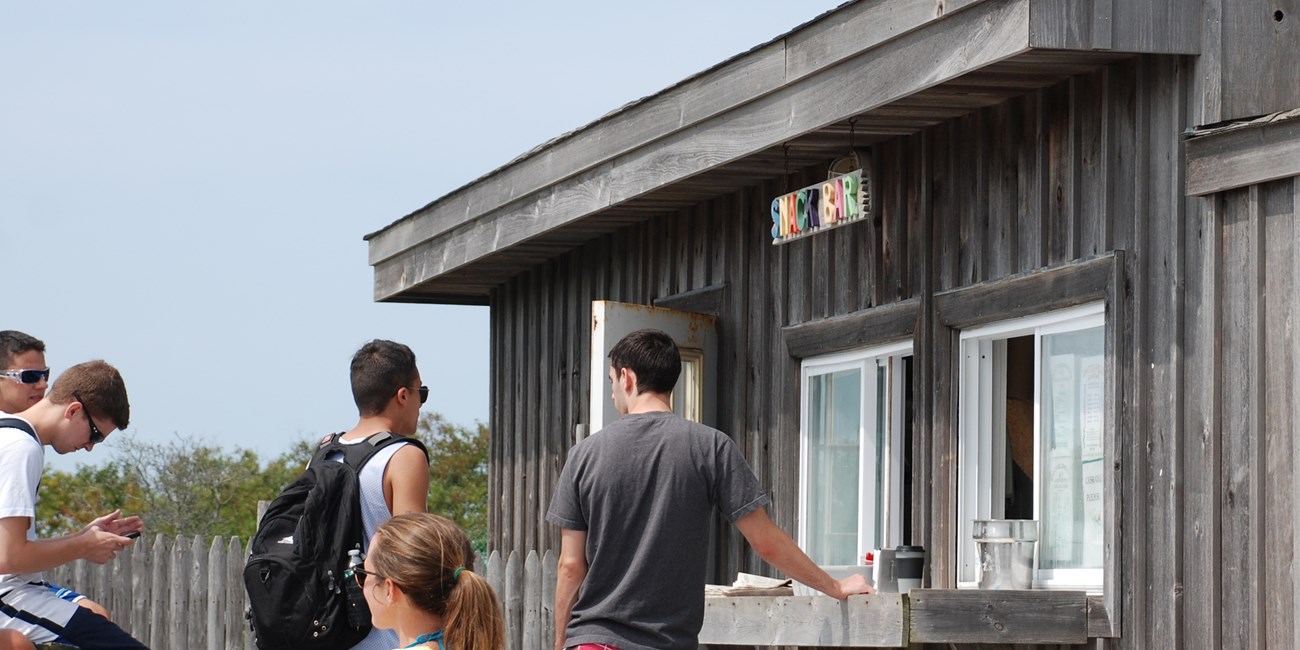 Visitors order food at the Watch Hill Snack Bar