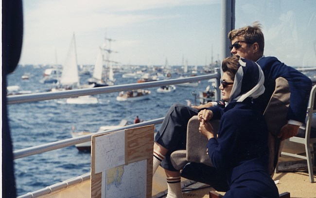 Jackie Kennedy in Scarf and Sunglasses