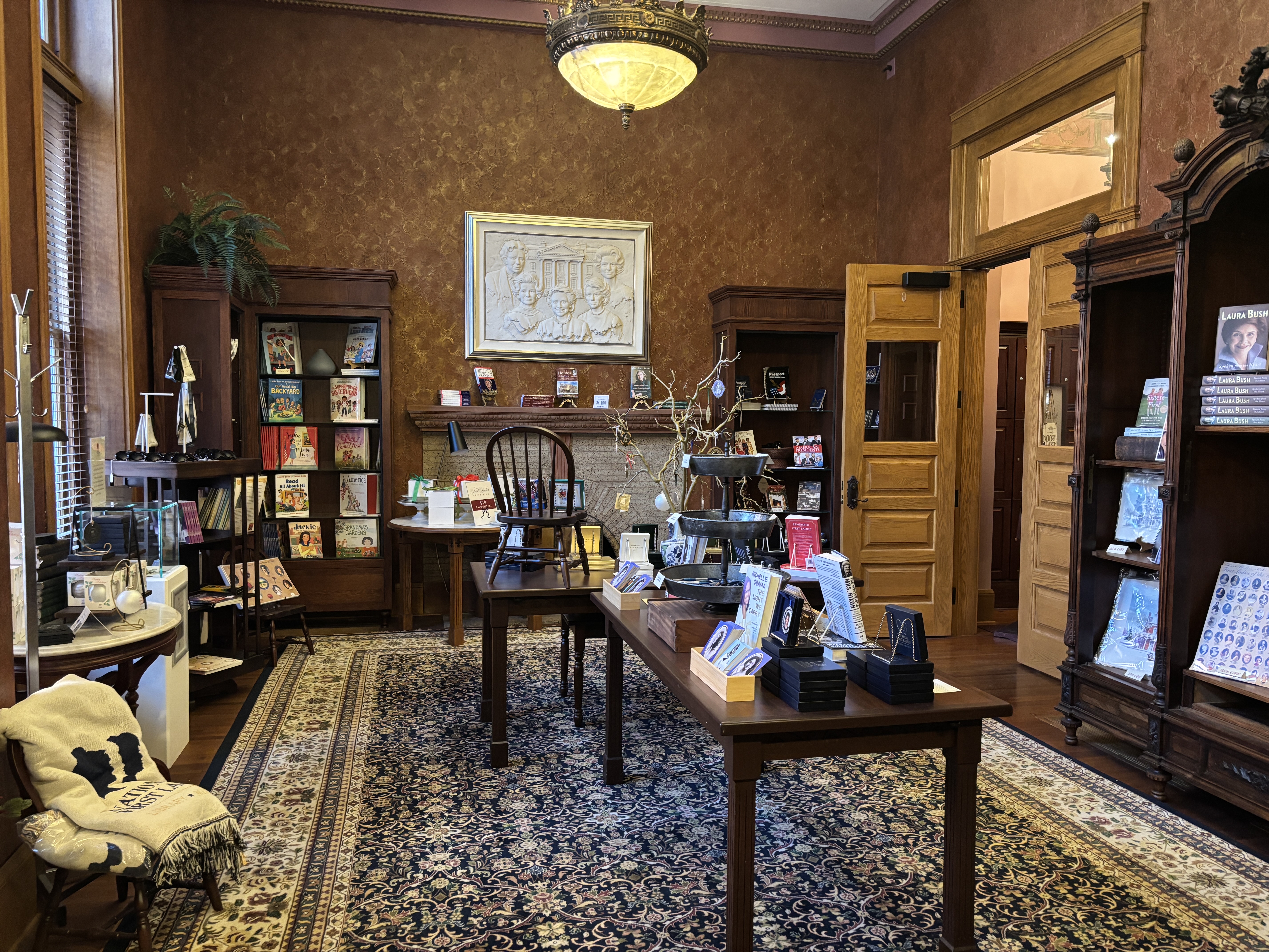 a wide view of the visitor center park store with bookcases and display items available for sale