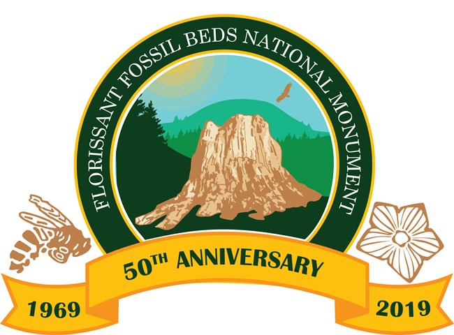 Logo artwork features petrified tree stump, fossil wasp, and fossil flower