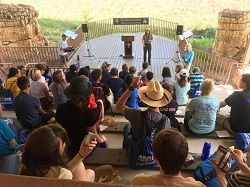 Ranger talking to students in amphitheater