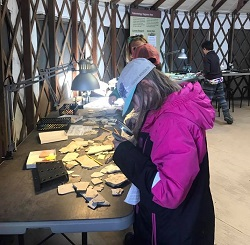 Students investigating fossil in Fossil Lab