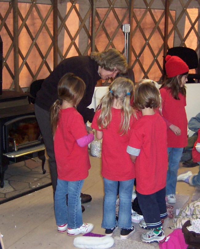 A ranger teaches students about fossils A ranger teaches students about fossils