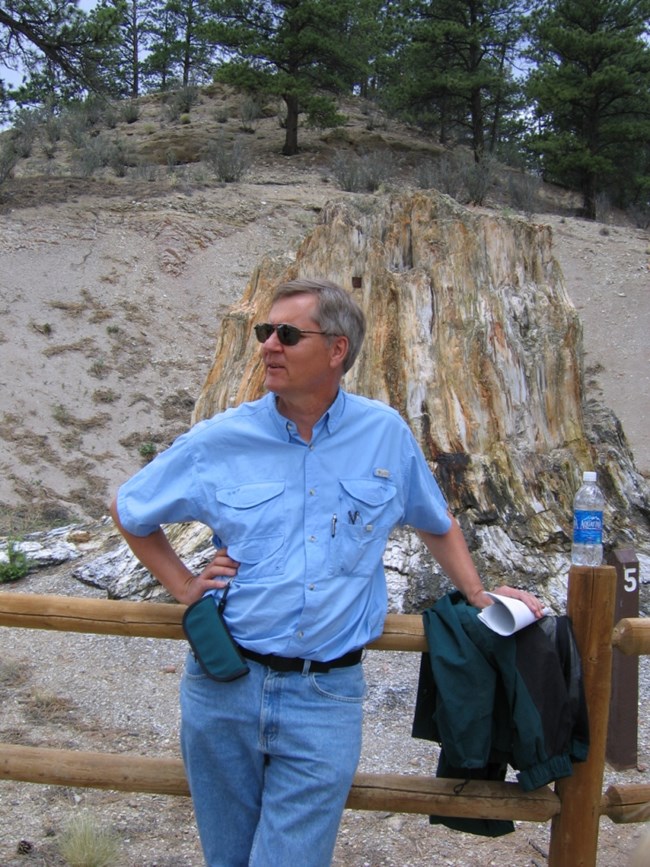 Dr. herb Meyer in front of Florissant's "The Big Stump"