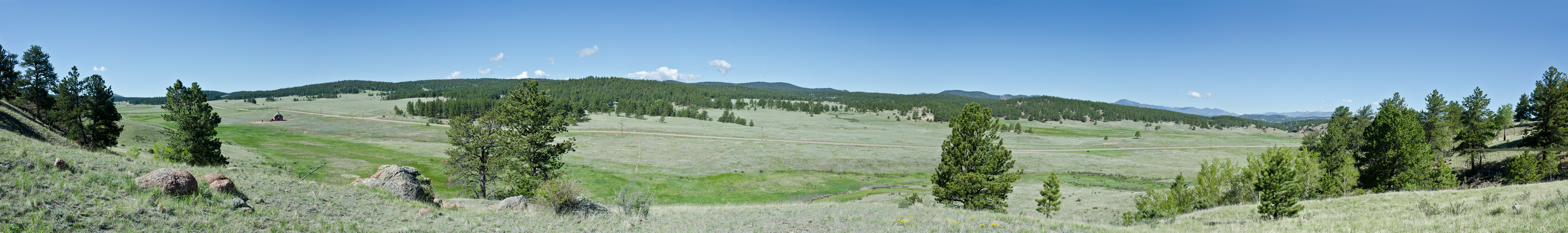A valley panorama seen from the side of a hill.