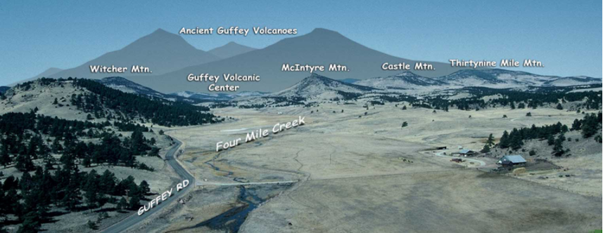 View of flat valley and mountains in distance with drawing depicting ancient volcano
