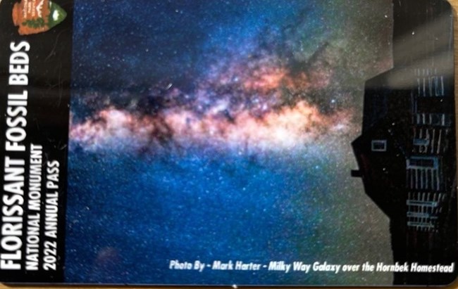 Florissant Fossil Beds Annual 2022 Pass with image of Milky Way over Hornbek Homestead