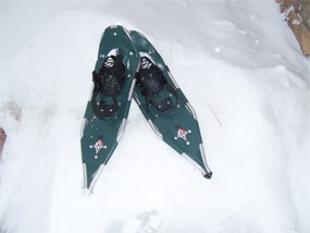 A pair of snowshoes in a snow drift