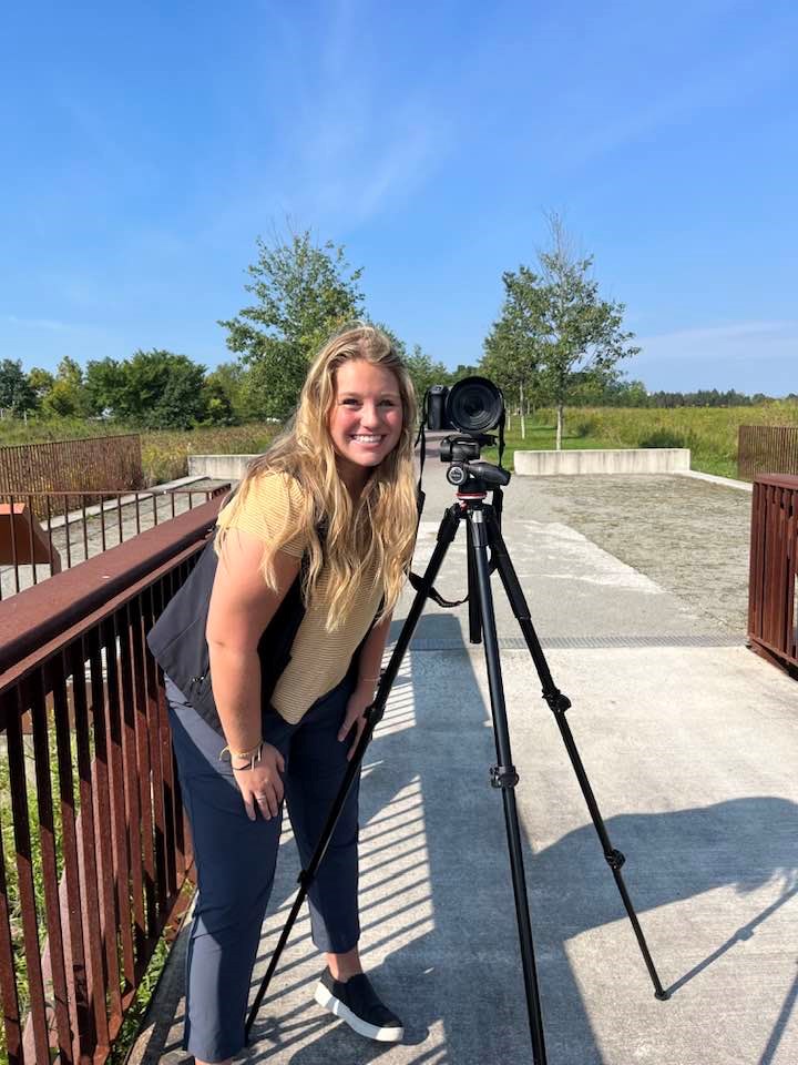 Intern Emma with camera.