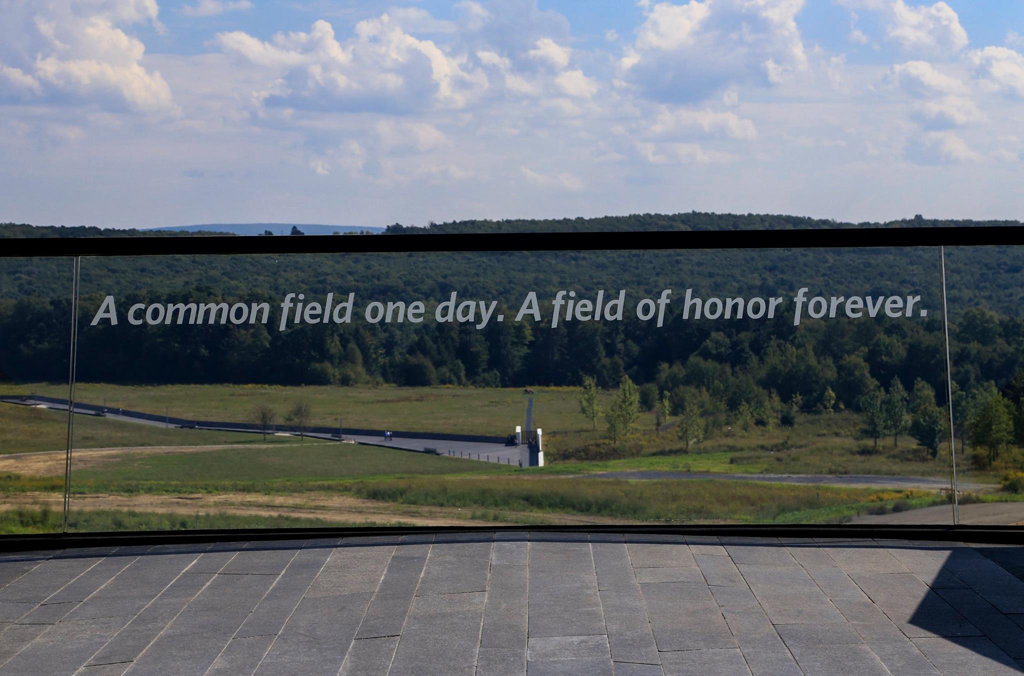 Window overlooking the Flight 93 crash site. Etched in the window are the words Window overlooking the Flight 93 crash site. Etched in the window are the words