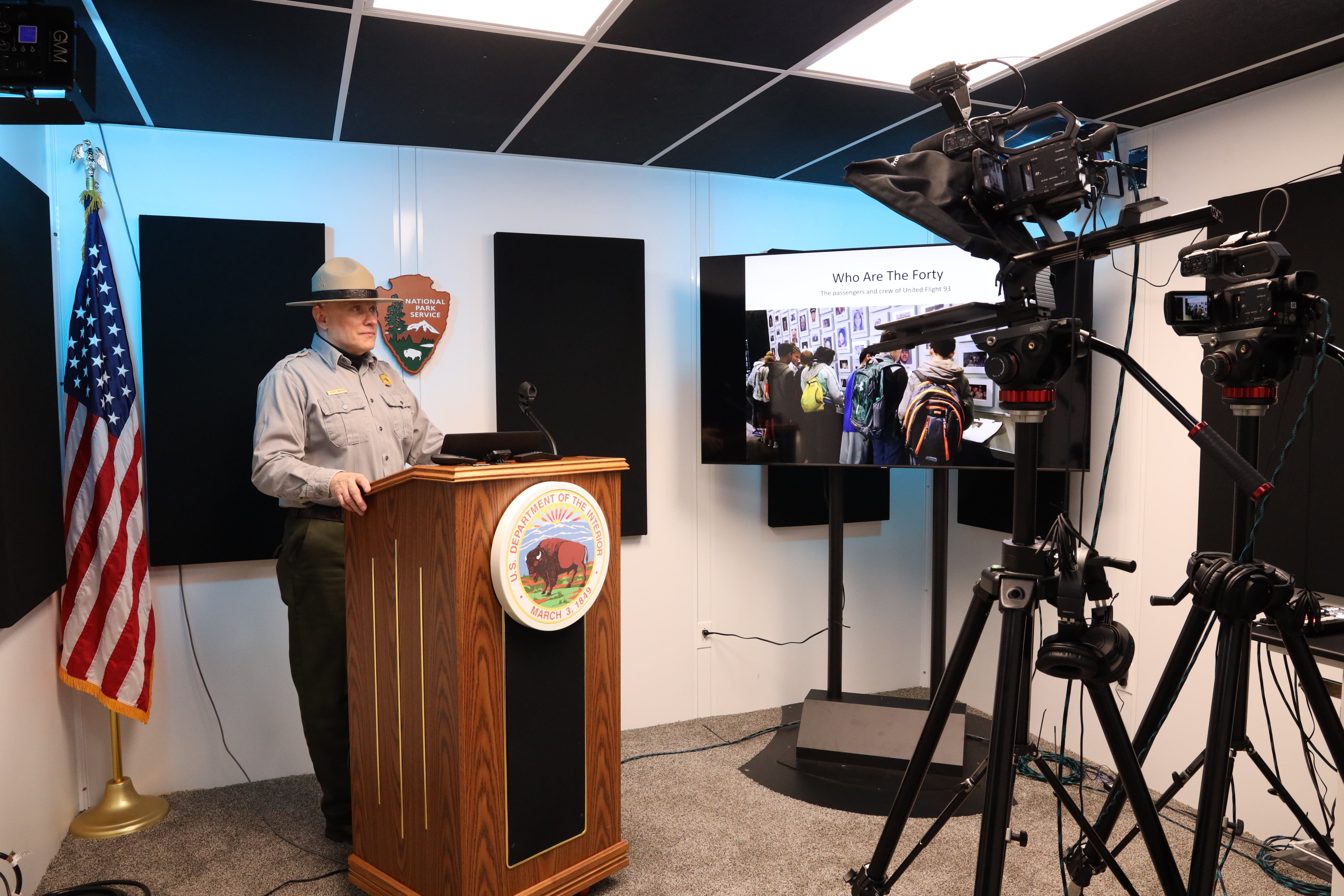 Park Ranger standing in front of cameras.
