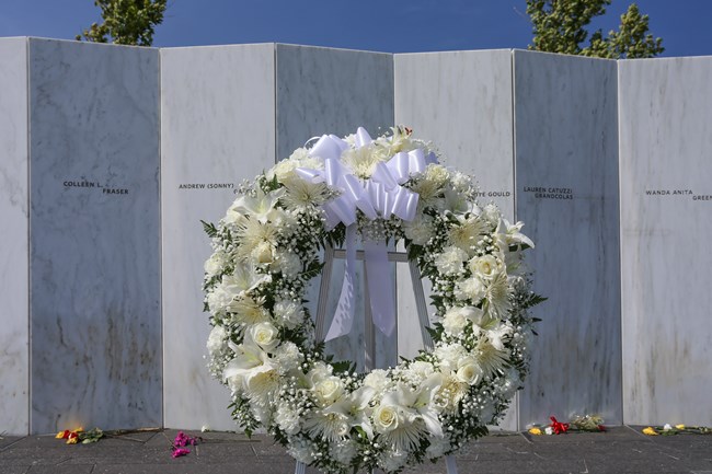 A wreath at the Wall of Names