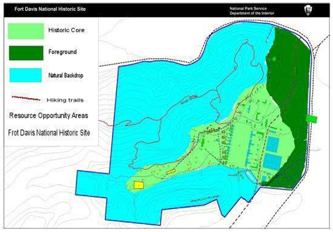 A map with light green representing historic Core, forest green representing foreground, and blue representing the natural backdrop, and red lines representing hiking trails.