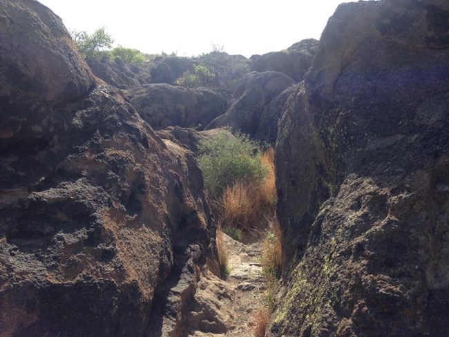 Trail between boulders.