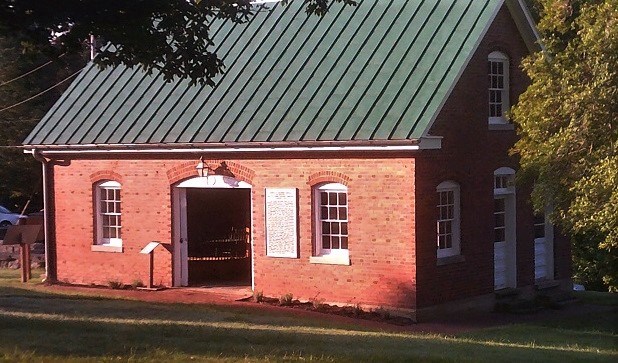 red brick building in cemetery