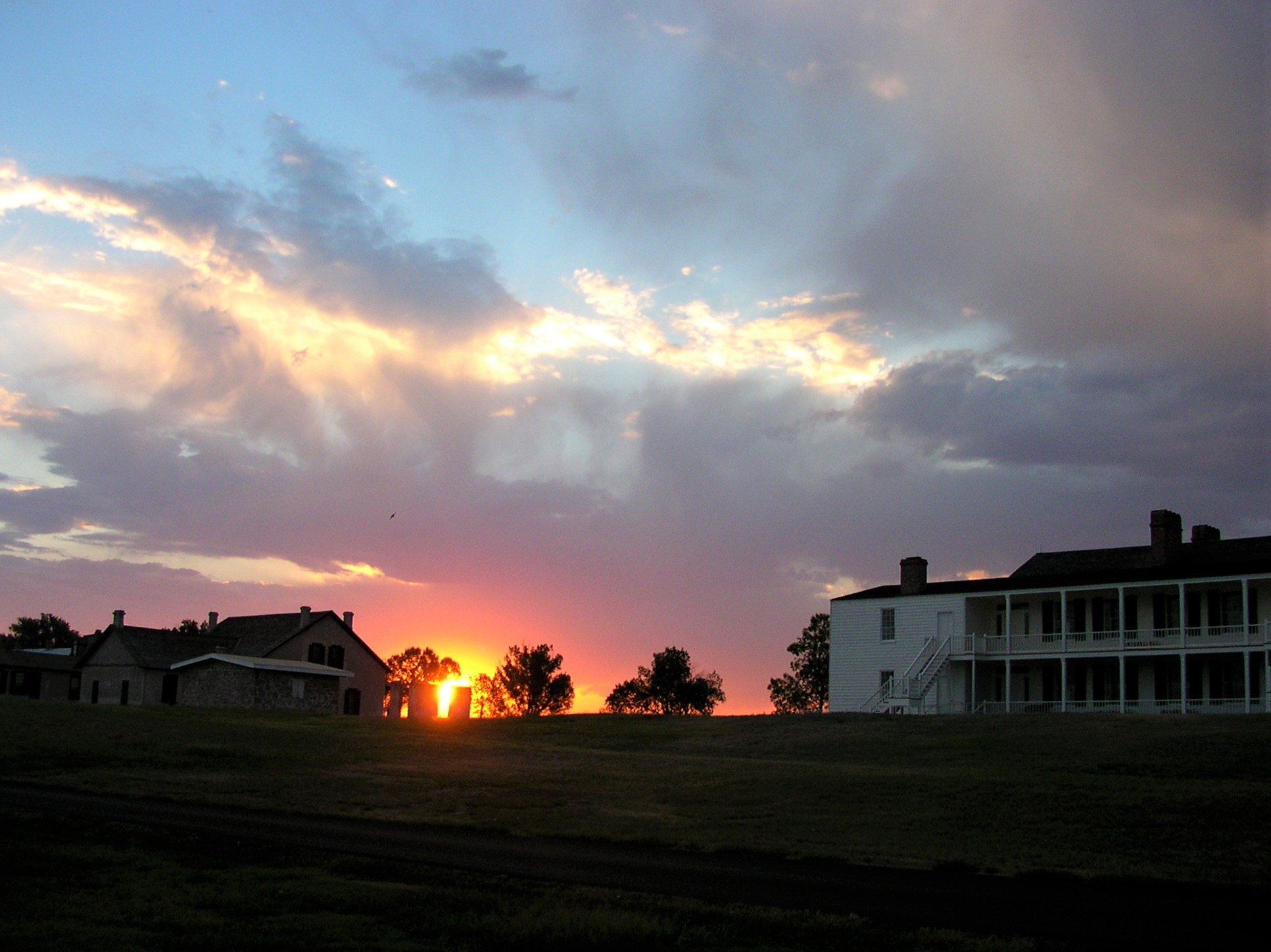 Old Bedlam Sunrise Early summer sunrise peeking out behind Old Bedlam and the ruins of the 1882 officer's quarters.