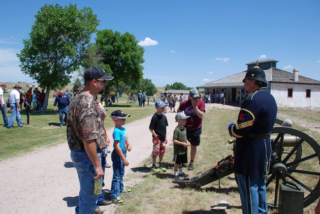 Ranger in 1800s Military Uniform talks with visitors.