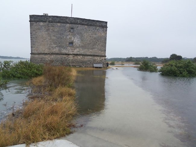 Flooding by the fort caused by high tide.