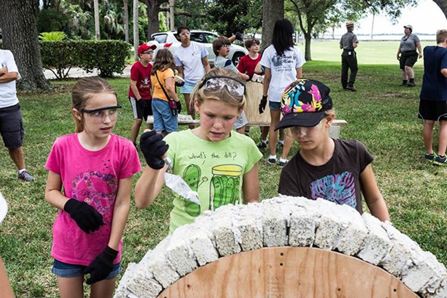 Kids building masonry arch. Kids building masonry arch.