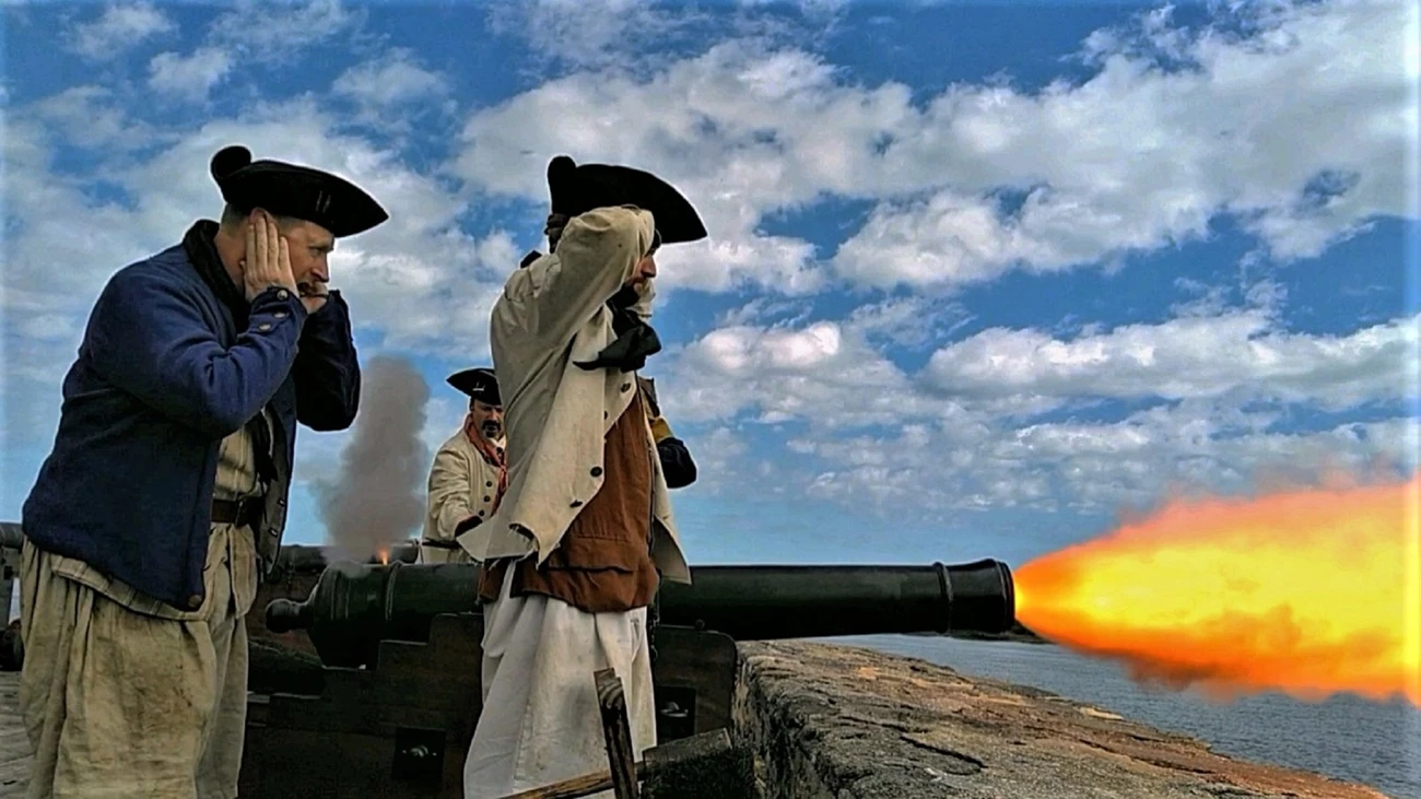 Cannon Blast Side view of re-enactors firing cannon