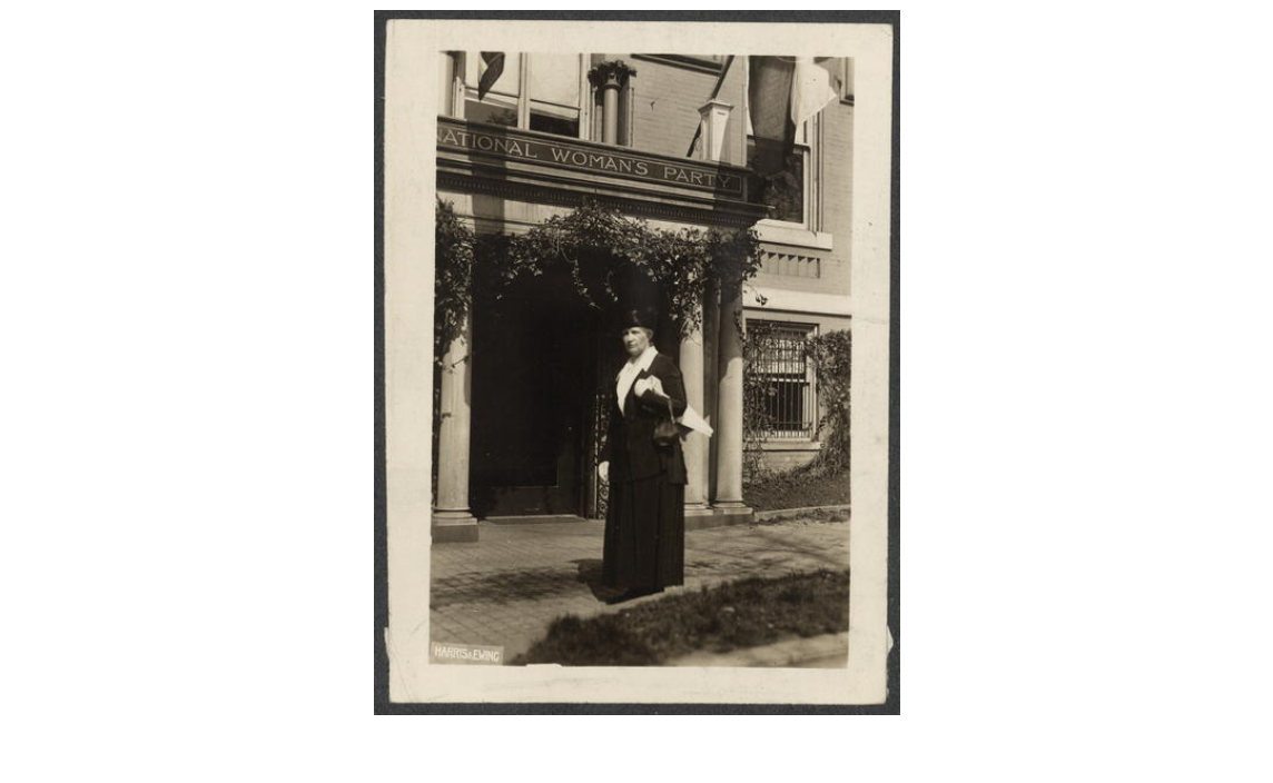 A black and white photograph of Sarah Colvin in front of a building with a sign that says "National Woman's Party"