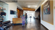 Inside of Visitor Center with Ranger and two visitors at desk and