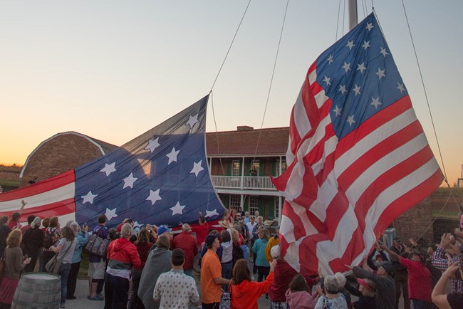Visitors participating in evening flag change in Star Fort.