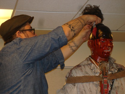 Man working on mannequin's hair