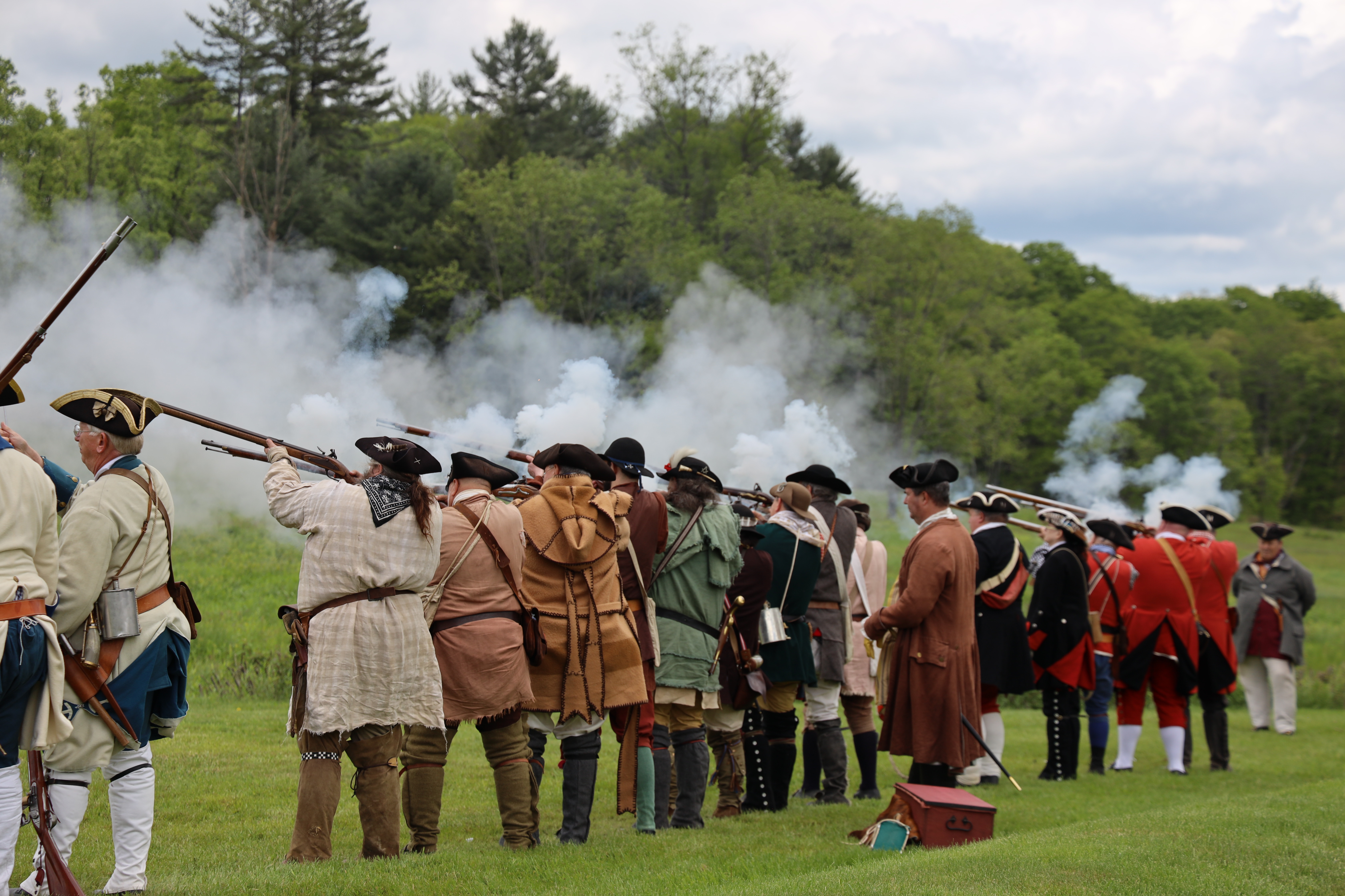 reenactment soldiers firing muskets